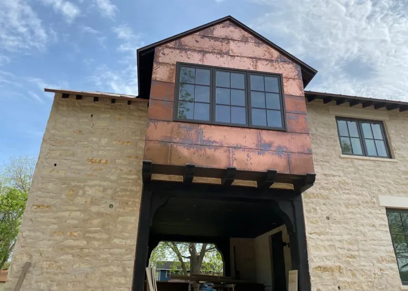 Copper metal panel facade on a stone building for Skylight Installation in Poplar Bluff