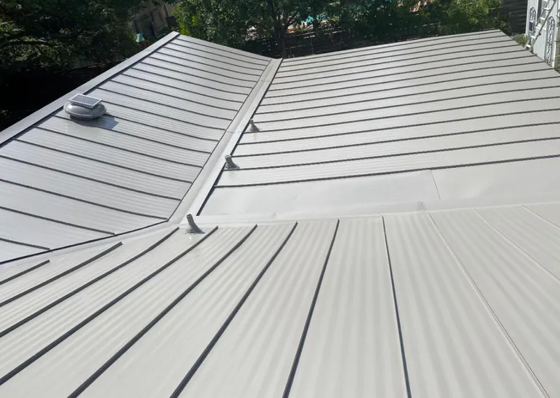 Solar attic fan installed on a metal roof for Roof Ventilation in Poplar Bluff